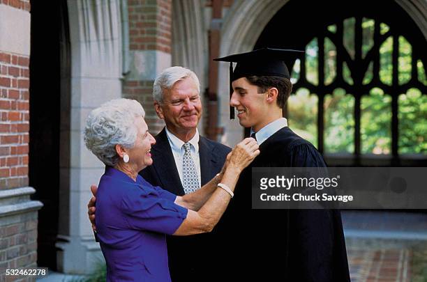 grandparents and graduate - perfect moment stock-fotos und bilder
