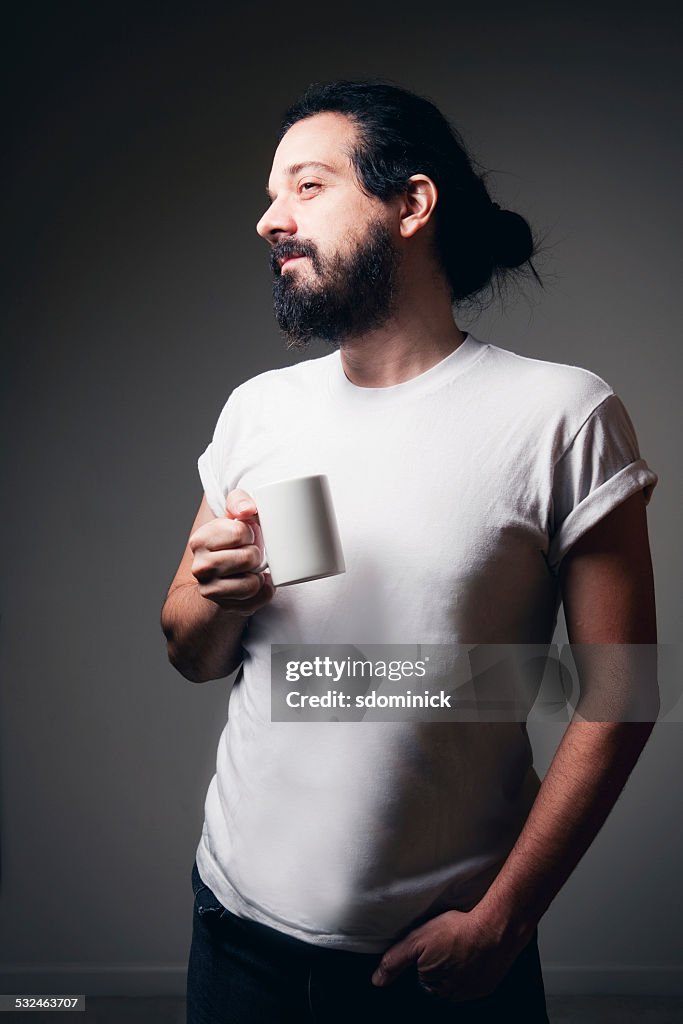 Hipster Guy Enjoying A Cup Of Coffee