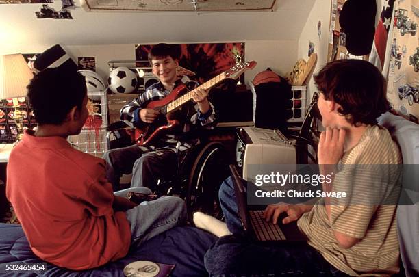 teen boys at leisure in room - black and white tv stock-fotos und bilder