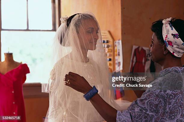 bride getting fitted - black veil brides stock pictures, royalty-free photos & images