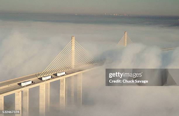 varina-enon bridge in fog - cable stayed bridge stock-fotos und bilder