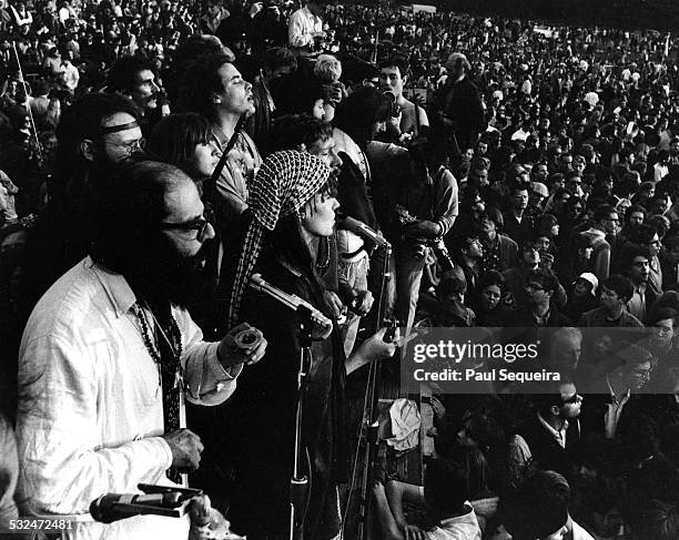 Poet Allen Ginsberg and entourage chanting Om or Aum amid a large crowd during the Human Be-In held at Golden Gate Park, San Francisco, California,...