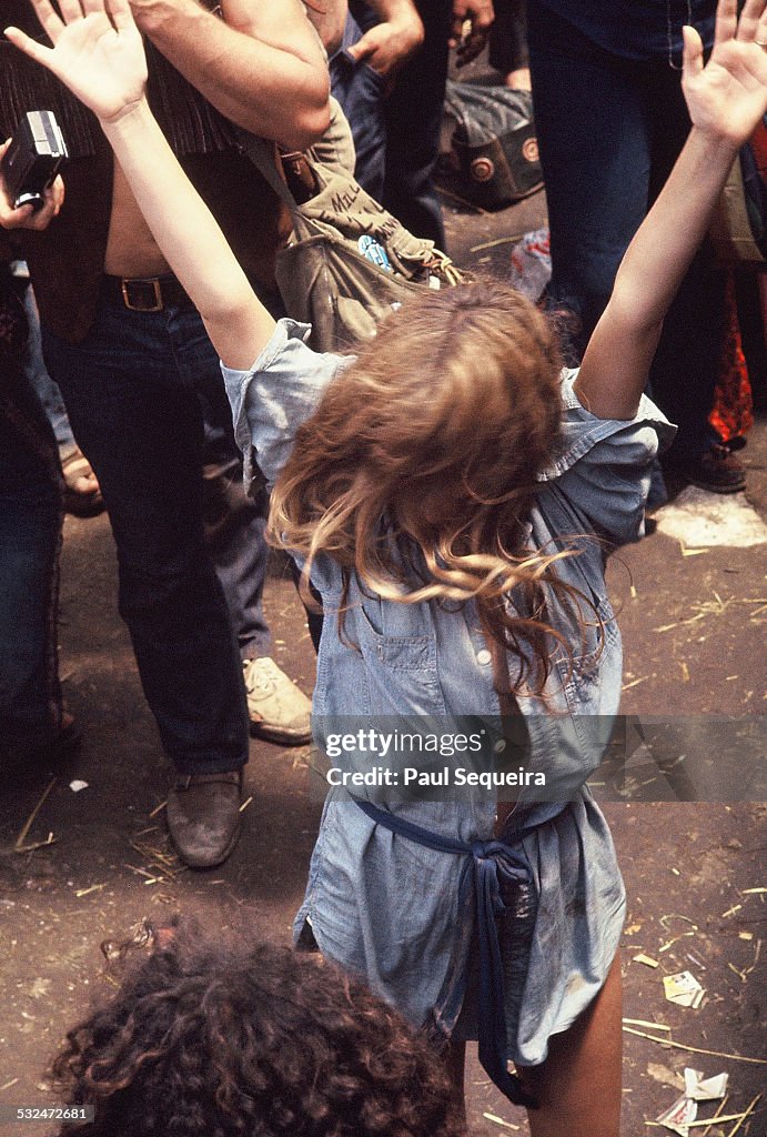 A woman dances while surrounded by a large crowd during the Kickapoo ...