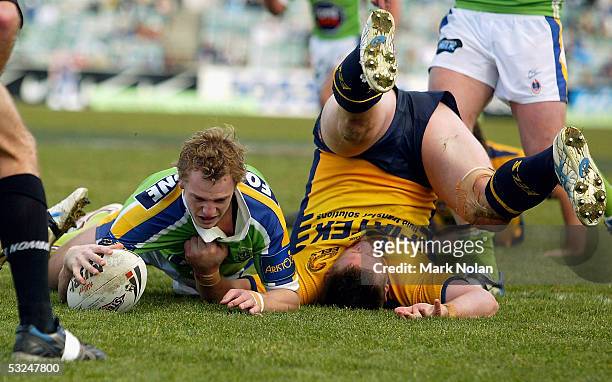 David Howell of the Raiders scores during the round 19 NRL match between the Canberra Raiders and the Parramatta Eels held at Canberra stadium on...