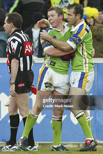 Todd Carney and Phil Graham of the Raiders celebrate Grahams try during the round 19 NRL match between the Canberra Raiders and the Parramatta Eels...