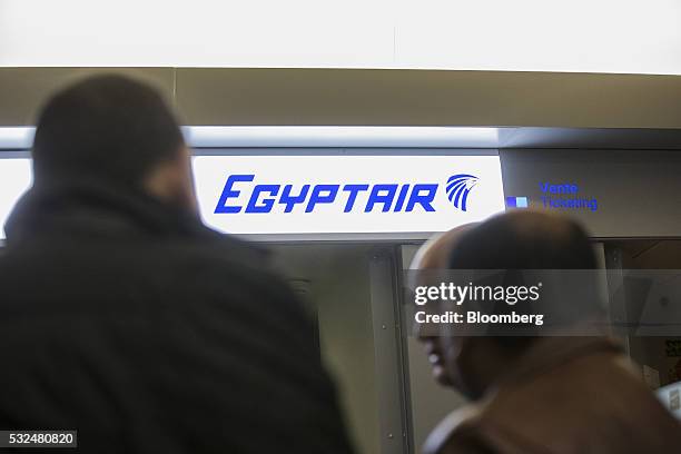 The EgyptAir Airlines logo sits illuminated above the company's flight ticket office at Charles de Gaulle airport, operated by Aeroports de Paris, in...