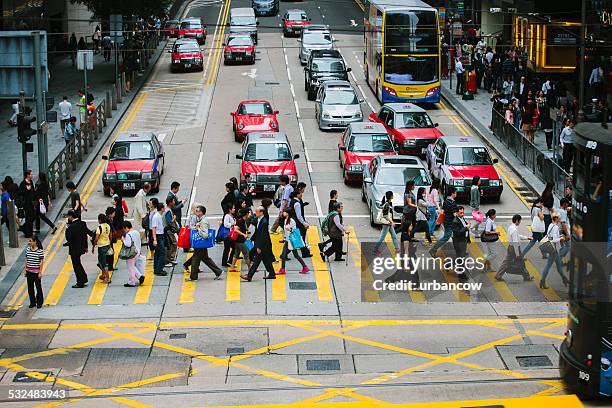 crossing the road, central, hong kong - central district hong kong stock pictures, royalty-free photos & images