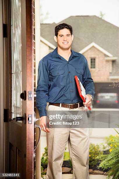 service industry: latin descent salesman at customer's front door. - dörrförsäljare bildbanksfoton och bilder