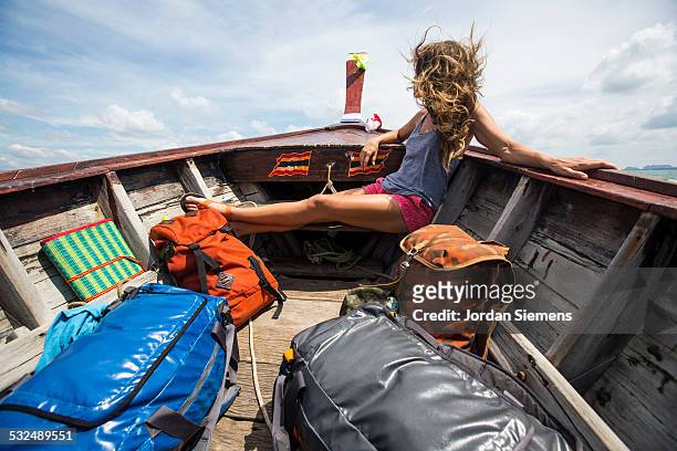 a woman on a boat adventure. - wonderlust stock pictures, royalty-free photos & images