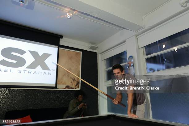 Model is seen playing pool prior to participating in a fashion show at the launch of Michael Strahan's new MSX clothing line for JC Penney on May 18,...