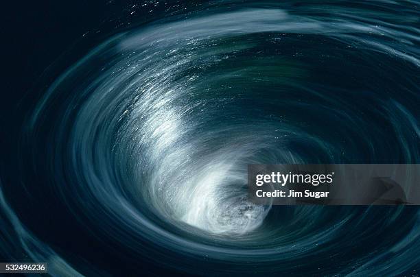 whirlpool by hydroelectric dam - draaikolk stockfoto's en -beelden