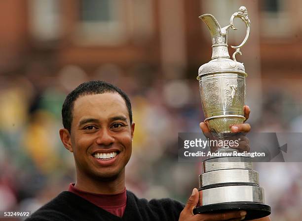 Tiger Woods of the USA holds the Claret Jug aloft after securing a five shot victory at the 134th Open Championship at Old Course, St Andrews Golf...