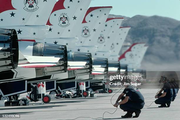 technicians behind f-16c fighting falcons - nellis air force base stock pictures, royalty-free photos & images