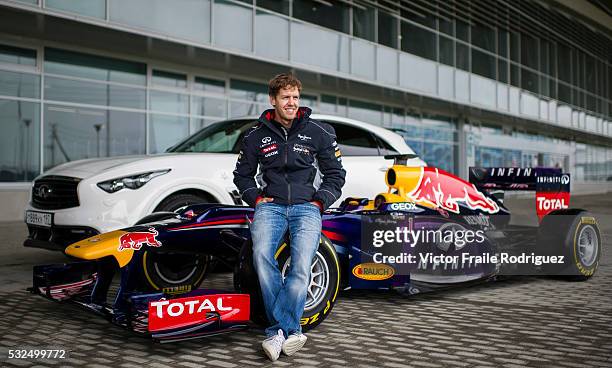 Infiniti Red Bull Racing driver and Formula One triple World Champion Sebastian Vettel of Germany poses for a photograph in front of the Adler Arena...