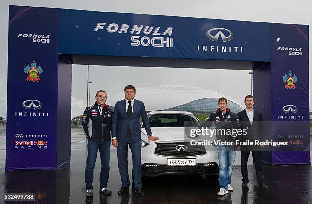 Infiniti Red Bull Racing driver and Formula One triple World Champion Sebastian Vettel of Germany, Oleg Zabara, Deputy General Director of OJSC...