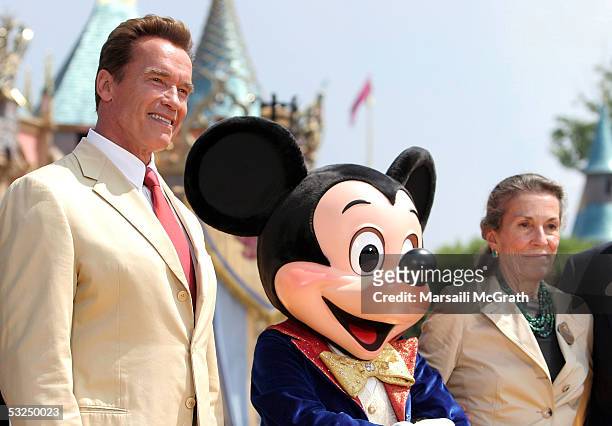 Governor of California and actor Arnold Schwarzenegger, Mickey Mouse and Diane Disney Miller, daughter of Walt Disney, pose at Disneyland's 50th...