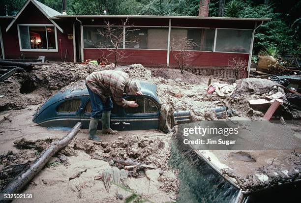 car buried by mud - mudslide stock pictures, royalty-free photos & images