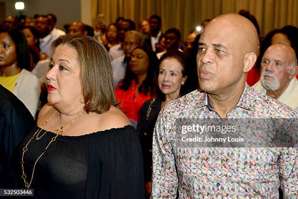 Former President of Haiti Michel J. Martelly and wife Sophia SaintRémy attend conversation with Elizabeth Guérin signing copy of his new book Michel...