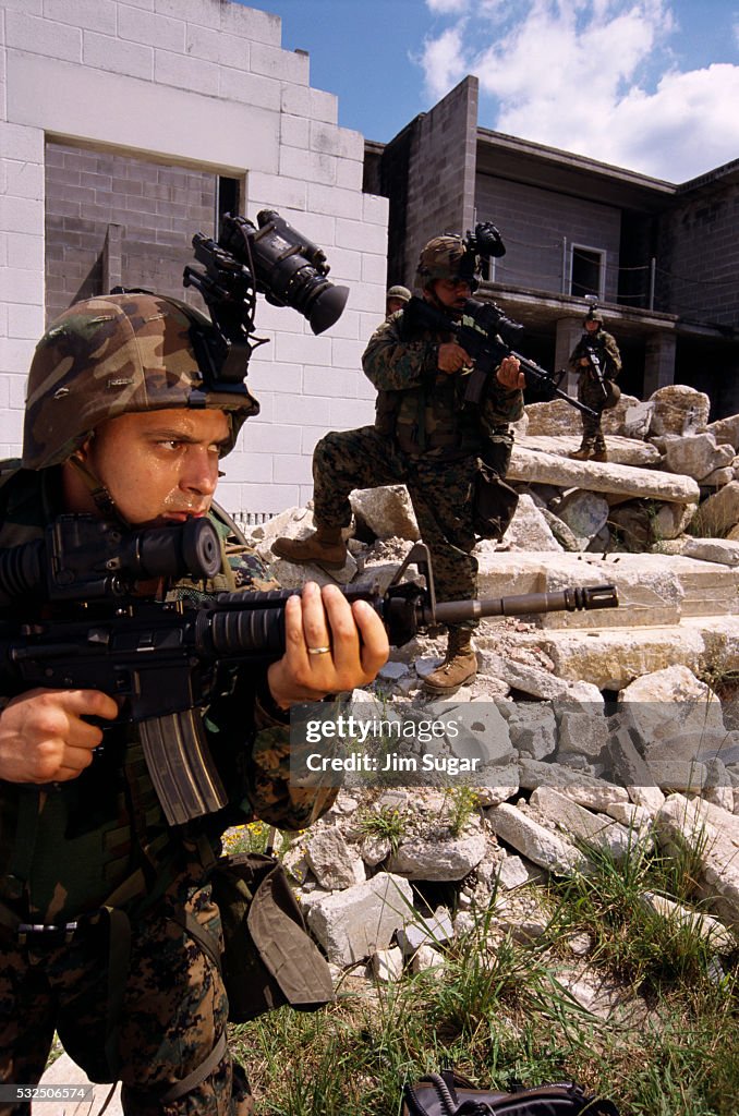 Armed Marines with Surveillance Gear