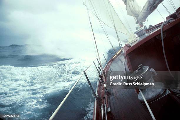 yacht sailing in rough seas - boot stock-fotos und bilder