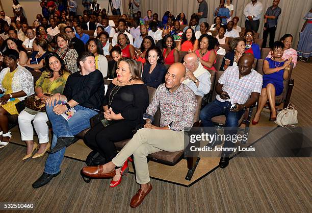 Former President of Haiti Michel J. Martelly and wife Sophia SaintRémy attend conversation with Elizabeth Guérin signing copy of his new book Michel...