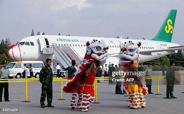 Spring Airlines, a privately-owned Chinese carrier, with its new Airbus 320 prepares with a traditional lion dance for the maiden flight from...