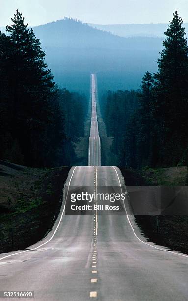 straight road - hill stock pictures, royalty-free photos & images
