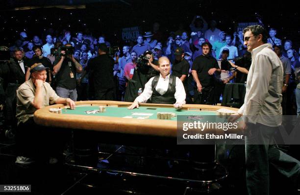 Steve Dannenmann of Maryland watches as Australian Joseph Hachem decides what to do before the last card is turned over on the final hand of the...