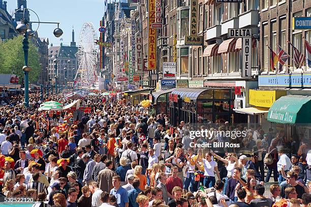 crowds at a street market on queen's day - amsterdam market stock pictures, royalty-free photos & images
