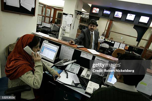 Geo TV's Islamabad Bureau Chief Hamid Mir speaks to his assignments chief editor January 18, 2005 in Islamabad, Pakistan. The Musharraf government...