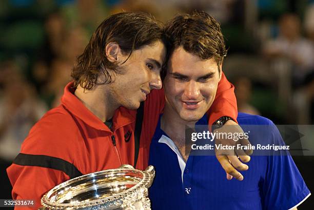 Rafael Nadal of Spain consoles Roger Federer of Switzerland during the trophy presentation after his men's final match during the Australian Open...