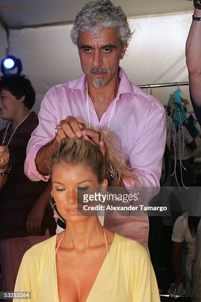 Hair stylist Pipino prepares model Marissa Miller backstage at the Sais By Rosa Cha Swimwear Collection 2006 during Miami Swimwear Fashion Week July...