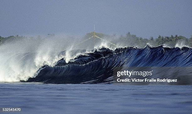 October 2004, Bali, Indonesia --- Waves peel across the reef in the Uluwatu break, south of Bali, Indonesia. Photo by Victor Fraile --- Image by ©...