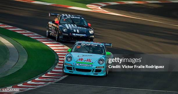 Sept 2009, Singapore --- Mak Hing Tak of Hong Kong steers his car during the Porsche Carrera Cup Asia at the Singapore's the Marina Bay street...