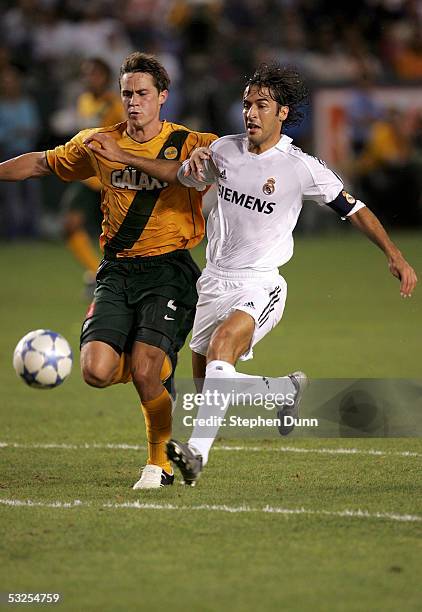 Raul Gonzalez of the Real Madrid dribbles against the defense of Raul Gonzalez of the Los Angeles Galaxy at the Home Depot Center on July 18, 2005 in...