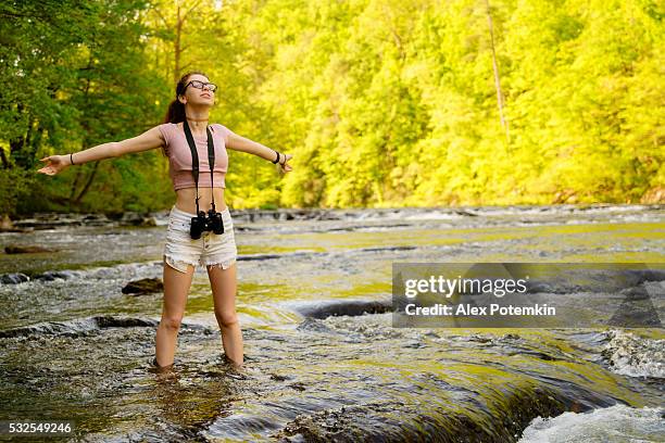 teenager girl exploring wildlife. oosterneck creek, great smoky mountains, tennessee - great smoky mountains stock pictures, royalty-free photos & images