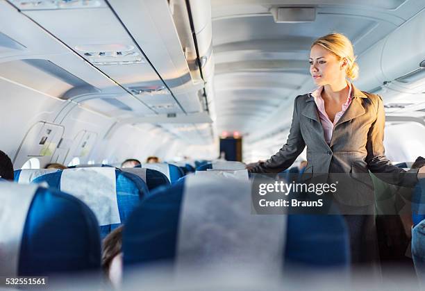 flight attendant on duty. - steward stockfoto's en -beelden