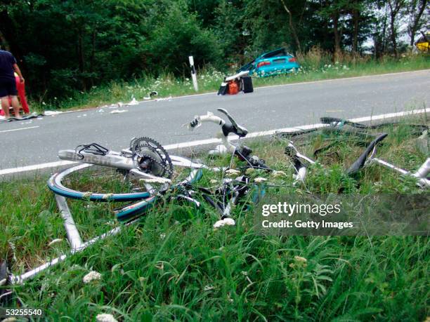 Broken bicycles and debris litter the scene of a fatal accident involving some of Australia's top women cyclists near the town of Gera, on July 18,...