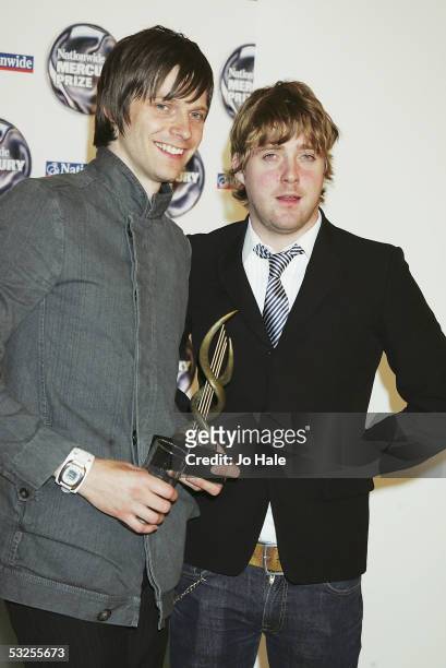 Ricky Wilson and Nick Hodgson of Kaiser Chiefs, nominated for 'Employment', pose at the shortlist launch for the 2005 Nationwide Mercury Prize at The...