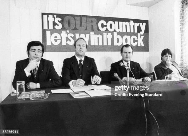 Members of the National Front organisation speaking to the press during their Manifesto Conference, 18th April 1978. From left to right Richard...