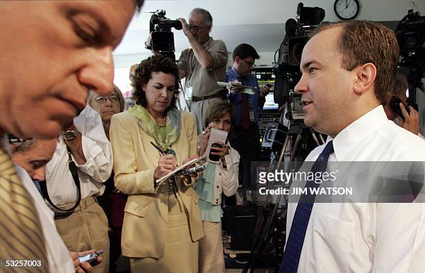 Washington, UNITED STATES: White House Spokesman Scott McClellan talks to reporters in the back of the Brady Press Room announcing that US President...