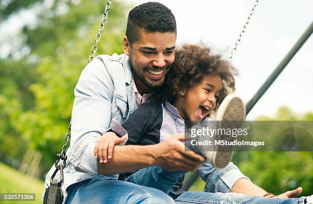 father and daughther. - playground equipment happy parent stock pictures, royalty-free photos & images