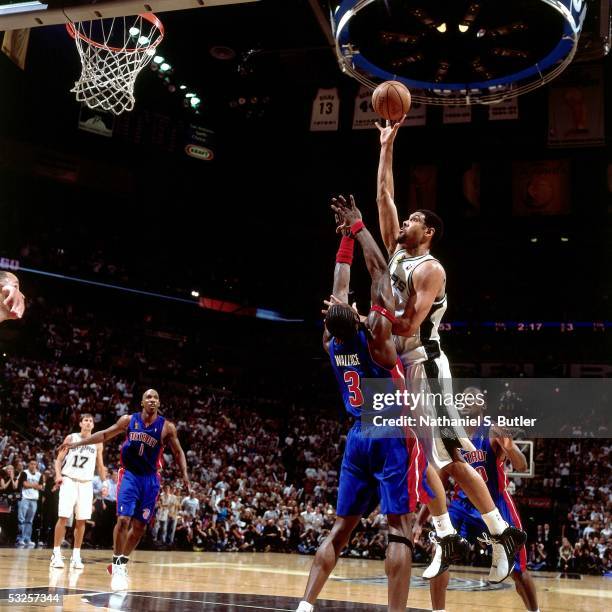 Tim Duncan of the San Antonio Spurs shoots against Ben Wallace of the Detroit Pistons in Game Seven of the 2005 NBA Finals June 23, 2005 at the SBC...