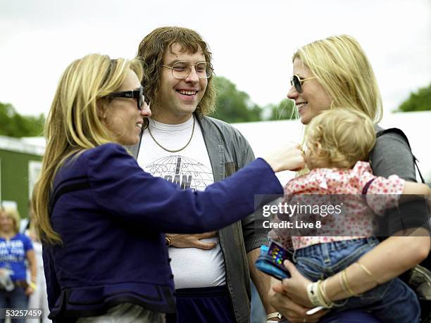 An unidentified woman, David Walliams, Gwyneth Paltrow and her baby Apple chat backstage at "Live 8 London" in Hyde Park on July 2, 2005 in London,...