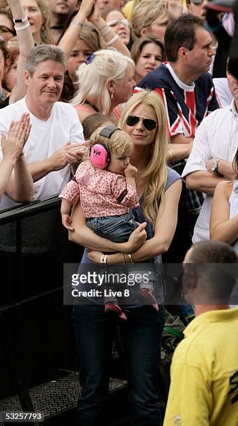 Actress and wife of Coldplay member Chris Martin, Gwyneth Paltrow, and their daughter Apple attend "Live 8 London" in Hyde Park on July 2, 2005 in...