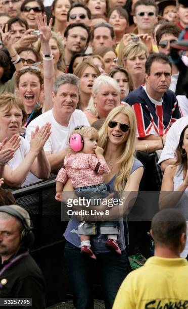 Actress and wife of Coldplay member Chris Martin, Gwyneth Paltrow, and their daughter Apple attend "Live 8 London" in Hyde Park on July 2, 2005 in...
