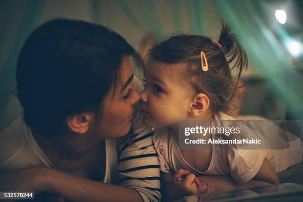enjoying time together before bed - bedtime stock pictures, royalty-free photos & images