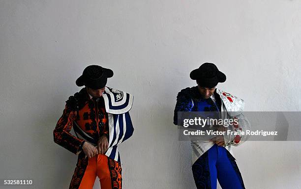 Spanish assistant bullfighters wait before the start of a bullfight during the 'Santiago' bullfighting fair in the northern Spanish town of Santander...