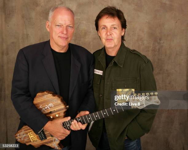 Dave Gilmour and Paul McCartney poses for a studio portrait backstage at "Live 8 London" in Hyde Park on July 2, 2005 in London, England. The free...