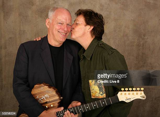 Dave Gilmour and Paul McCartney pose for a studio portrait backstage at "Live 8 London" in Hyde Park on July 2, 2005 in London, England. The free...